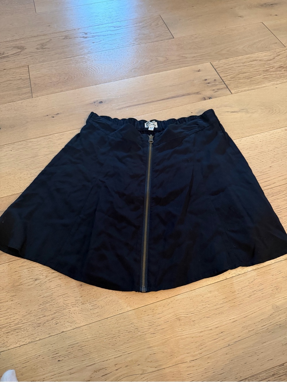 Kirra Black Front-Zip A-Line Midi Skirt with Gold Zipper